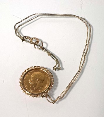 Lot 407 - A George V full sovereign dated 1912. Mounted...