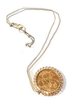 Lot 407 - A George V full sovereign dated 1912. Mounted...