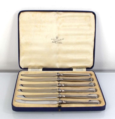 Lot 332 - A set of six silver handled butter knives,...