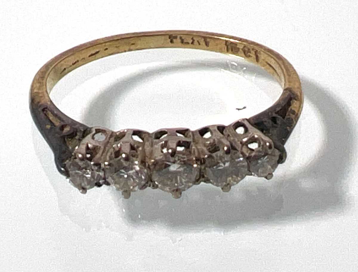 Lot 410 - A yellow metal and five stone diamond ring...