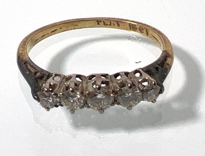 Lot 410 - A yellow metal and five stone diamond ring...