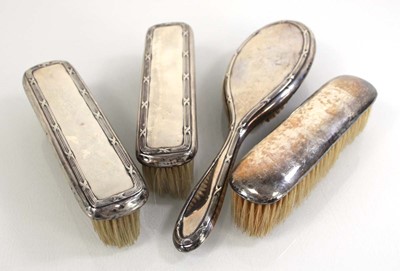 Lot 349 - Four silver backed hairbrushes, various dates...
