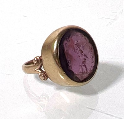 Lot 411 - A 19th century yellow metal and amethyst seal...
