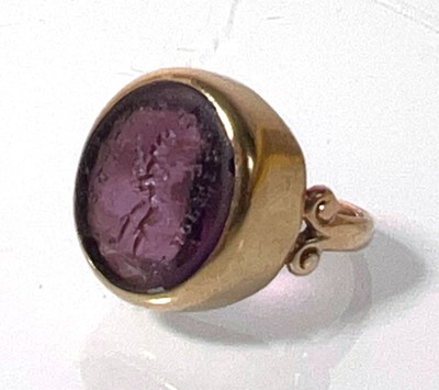 Lot 411 - A 19th century yellow metal and amethyst seal...