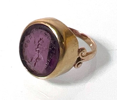 Lot 411 - A 19th century yellow metal and amethyst seal...