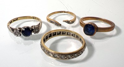 Lot 414 - A yellow metal, sapphire and diamond ring...