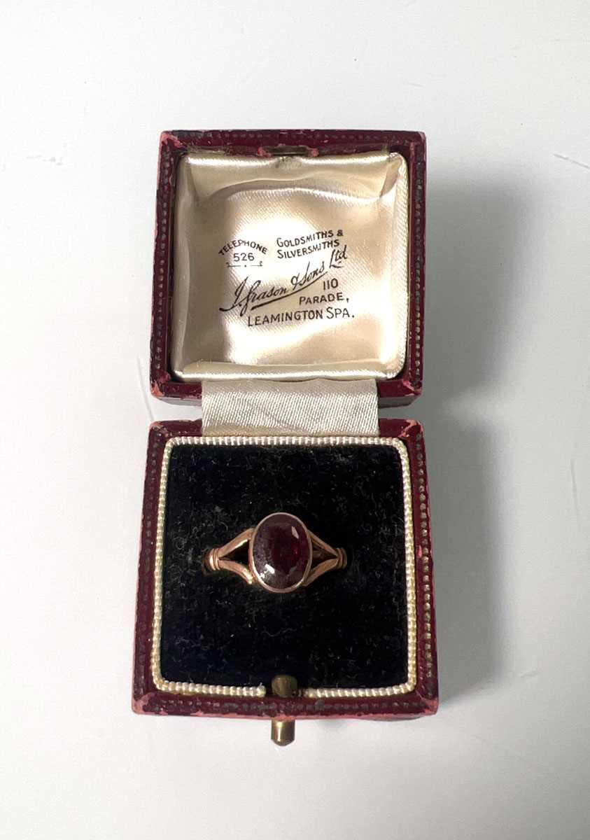 Lot 417 - An early 20th century 9ct gold and garnet ring...