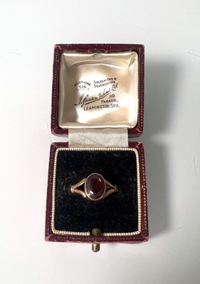 Lot 417 - An early 20th century 9ct gold and garnet ring...