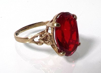 Lot 419 - A 9ct gold and garnet dress ring with openwork...