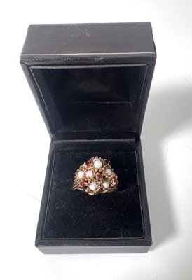 Lot 420 - A 9ct gold, opal and garnet dress ring, the...
