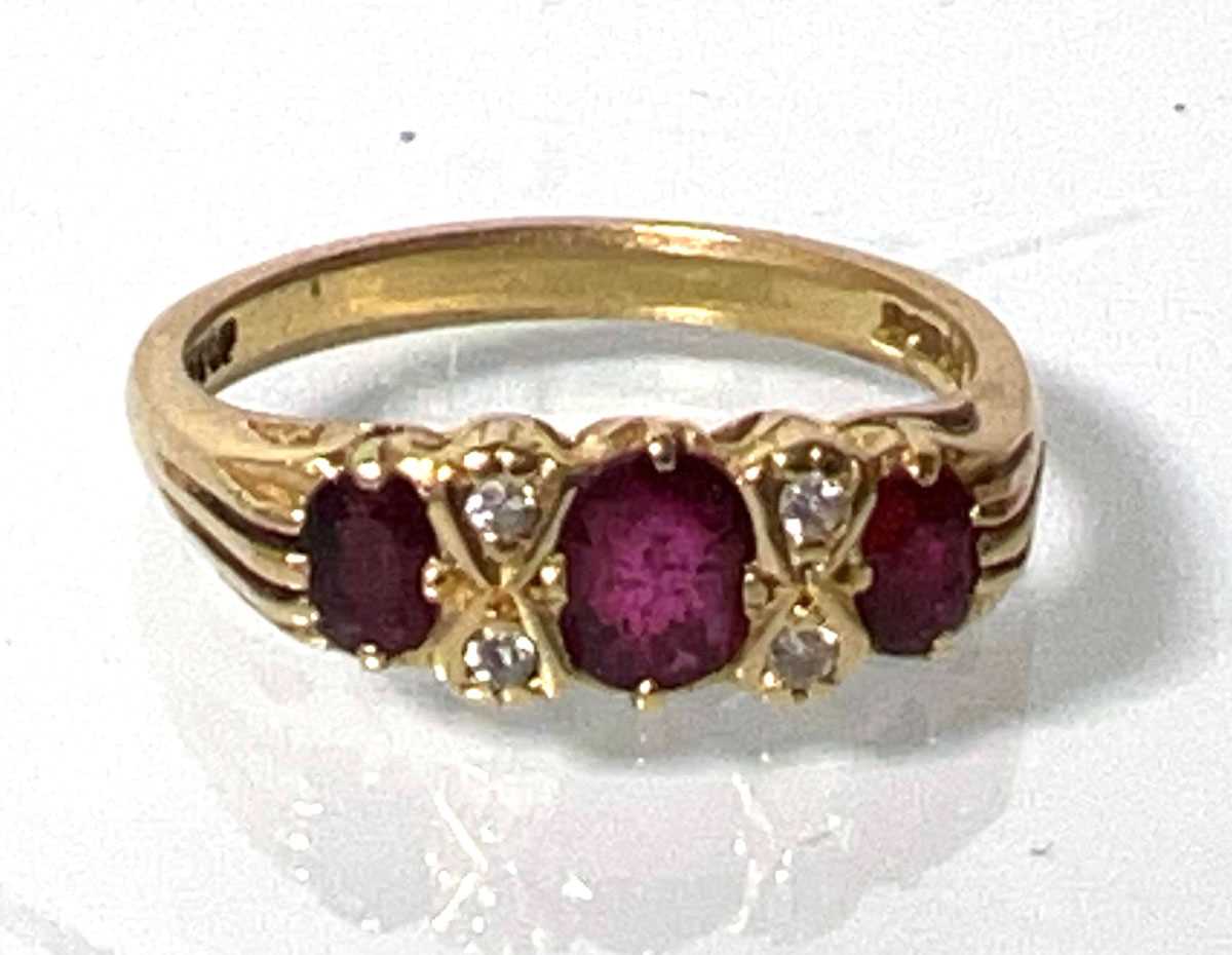 Lot 431 - An 18ct gold ruby and diamond ring. Approx....