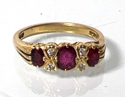 Lot 431 - An 18ct gold ruby and diamond ring. Approx....