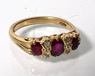 Lot 431 - An 18ct gold ruby and diamond ring. Approx....