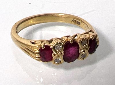 Lot 431 - An 18ct gold ruby and diamond ring. Approx....