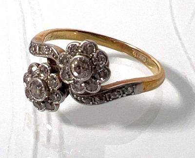 Lot 435 - A yellow metal and diamond crossover ring, the...