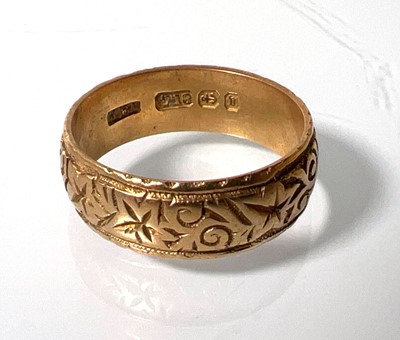 Lot 437 - A Victorian 18ct gold engraved wedding band....