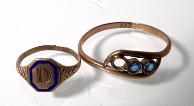 Lot 447 - A yellow metal miniature ring marked '333'...