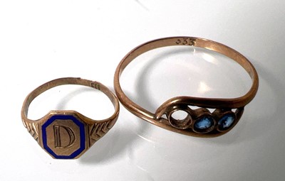 Lot 447 - A yellow metal miniature ring marked '333'...