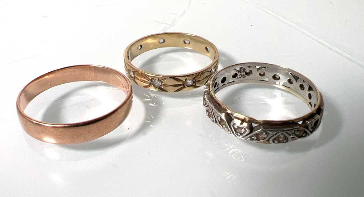 Lot 448 - Three yellow/white metal rings, one marked...