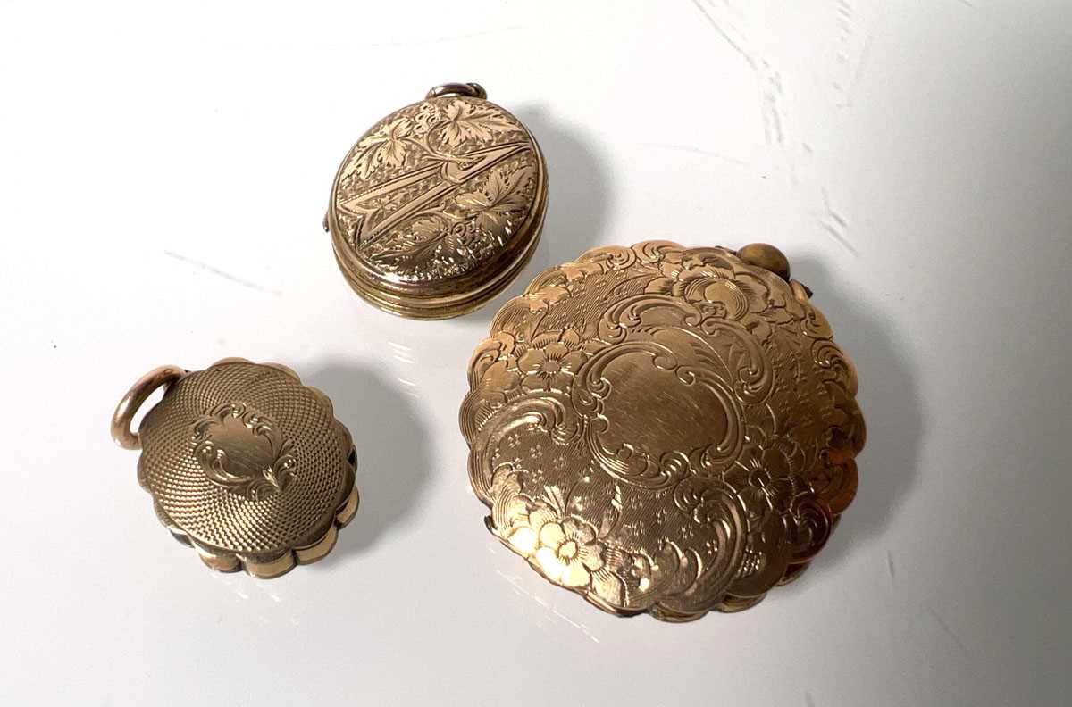 Lot 453 - Three 19th century yellow metal lockets, two...