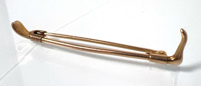 Lot 462 - A mid-20th century 9ct gold riding crop brooch....