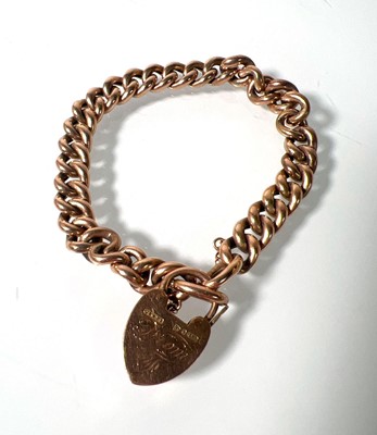 Lot 470 - A 9ct rose gold curb bracelet with heart...
