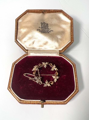 Lot 474 - A yellow metal and pearl garland brooch marked...