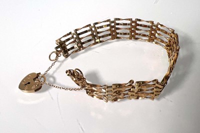 Lot 479 - A 9ct gold five-bar gate bracelet. Approx....