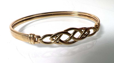 Lot 480 - A 9ct gold bracelet with Celtic openwork...