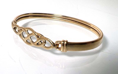 Lot 480 - A 9ct gold bracelet with Celtic openwork...