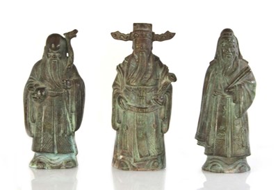 Lot 68 - A set of three Chinese bronze rank figures...