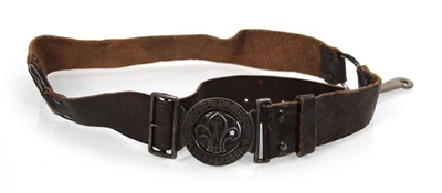 Lot 82 - A leather belt and Scouts buckle, the reverse...