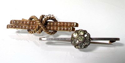Lot 436 - A yellow metal and seed pearl knot brooch...