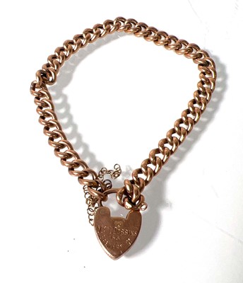 Lot 485 - A yellow metal curb bracelet with heart...