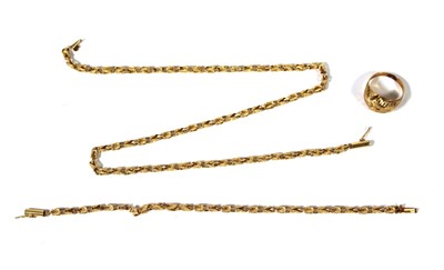 Lot 498 - A yellow metal bracelet together with a...