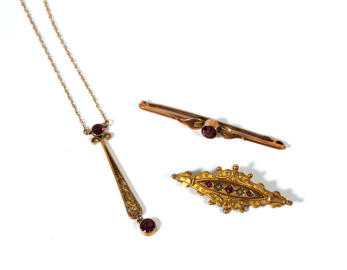 Lot 503 - Two early 20th yellow metal and garnet...