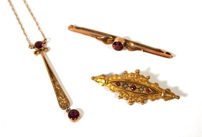 Lot 503 - Two early 20th yellow metal and garnet...