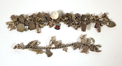 Lot 506 - Two silver and white metal charm bracelets...