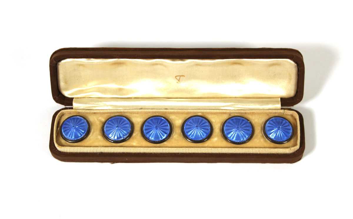 Lot 509 - A set of six white metal and enamel buttons in...