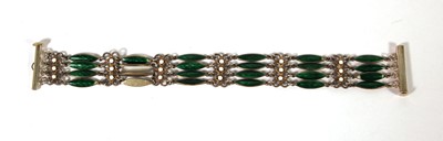 Lot 513 - A white metal and enamel four-bar bracelet in...