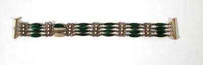 Lot 513 - A white metal and enamel four-bar bracelet in...