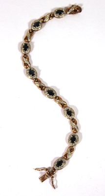 Lot 517 - A yellow metal and sapphire bracelet marked...