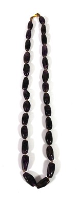 Lot 518 - An amethyst necklace with yellow metal clasp...