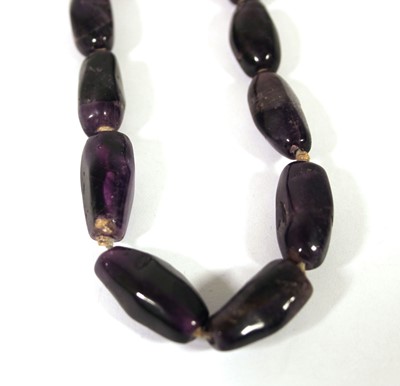 Lot 518 - An amethyst necklace with yellow metal clasp...