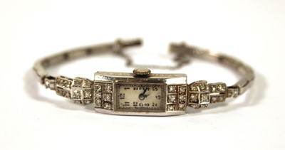 Lot 527 - A ladies mid-20th century white metal cocktail...