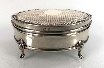 Lot 362 - A silver engine turned ring box of oval form...