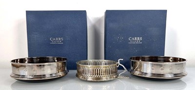 Lot 368 - A pair of silver mounted wine coasters, Carrs,...
