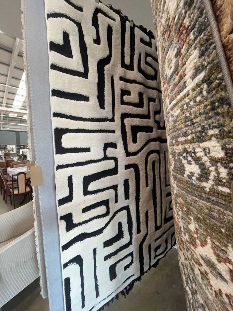 Lot 5006 - Carpet with black background and geometric...