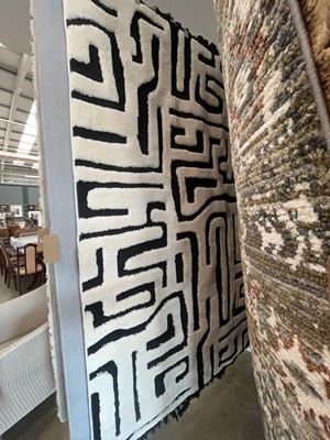 Lot 5006 - Carpet with black background and geometric...