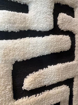Lot 5006 - Carpet with black background and geometric...
